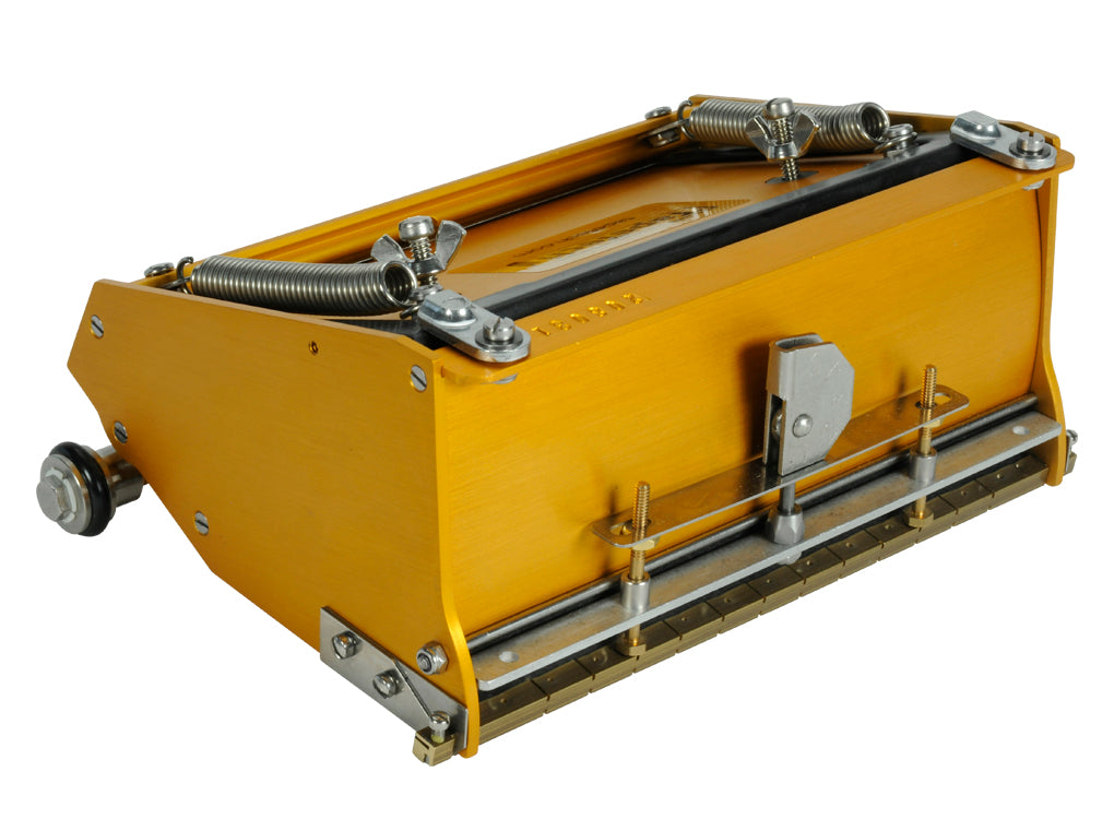 7-inch TapeTech EasyClean Finishing Box with gold aluminum body, brass blade holder, and crown control, quarter view