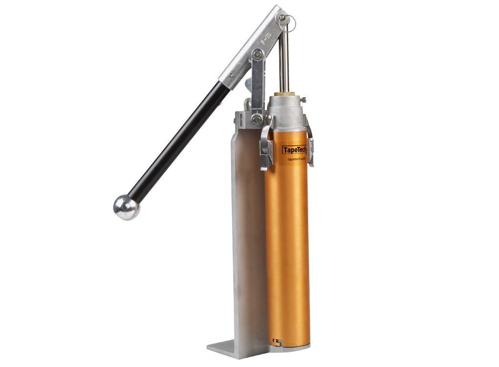 TapeTech 76TT-CA EasyClean Loading Pump with a gold body, grey leg and components, and a black handle, left side