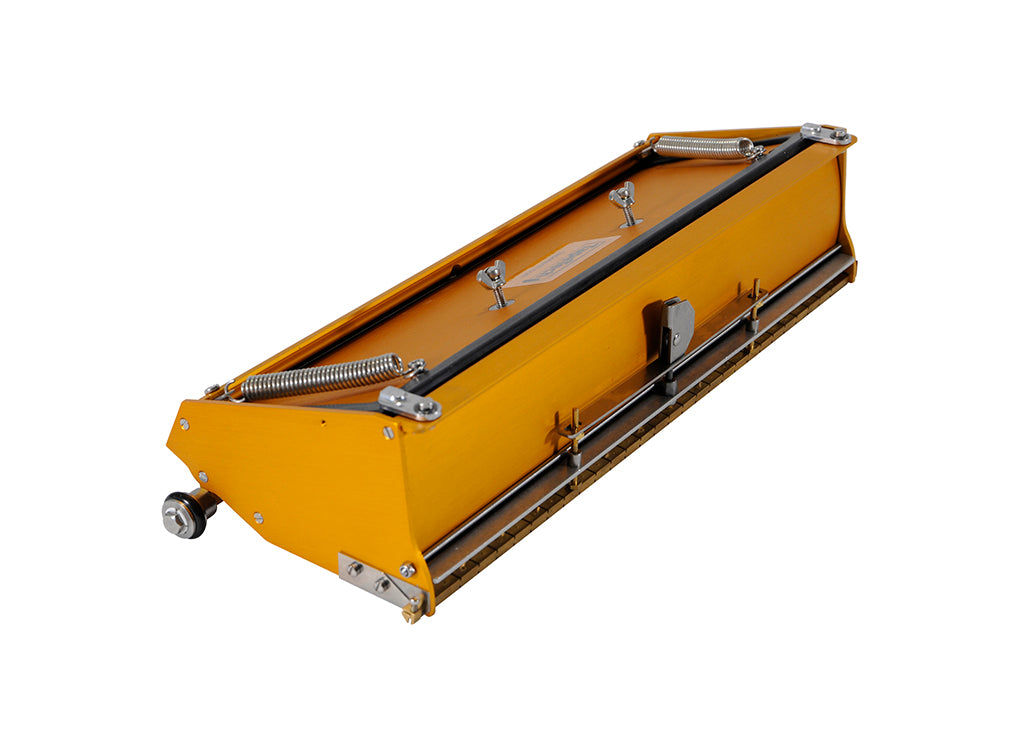 12-inch TapeTech EasyClean Finishing Box with gold aluminum body, brass blade holder, and crown control, quarter view