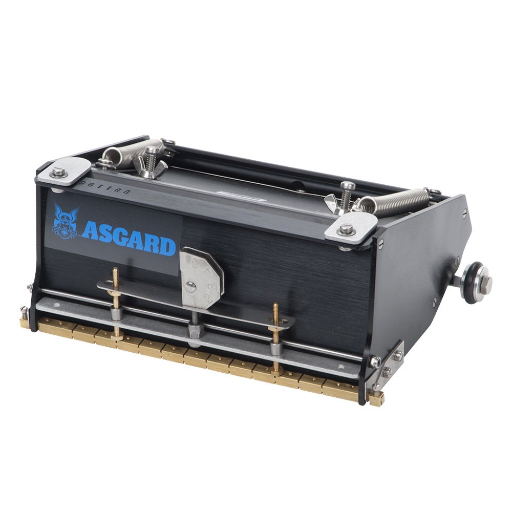 7-inch Asgard Finishing Box made with black anodized aluminum, brass blade holder, steel blade, adjustable crown, and wheels, left quarter view