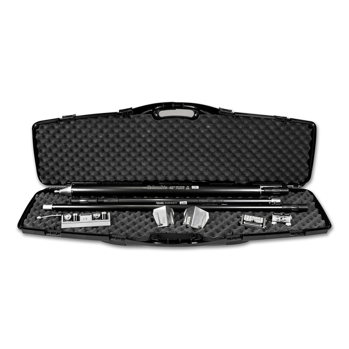 Open black foam-lined carrying case containing a Columbia compound tube, handles, flushers, applicators, corner roller, and angle head adaptor