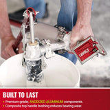 Person using Level 5 box filler attached to a compound pump to load mud from a bucket into a Level 5 mud runner
