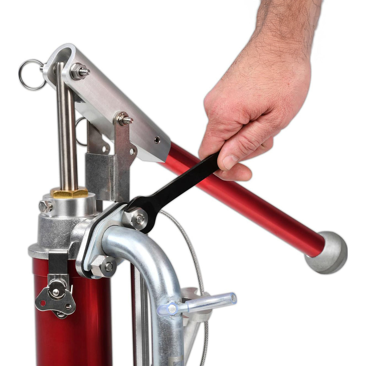 Close-up of person using wrench to attach a Level 5 gooseneck to a Level 5 mud pump