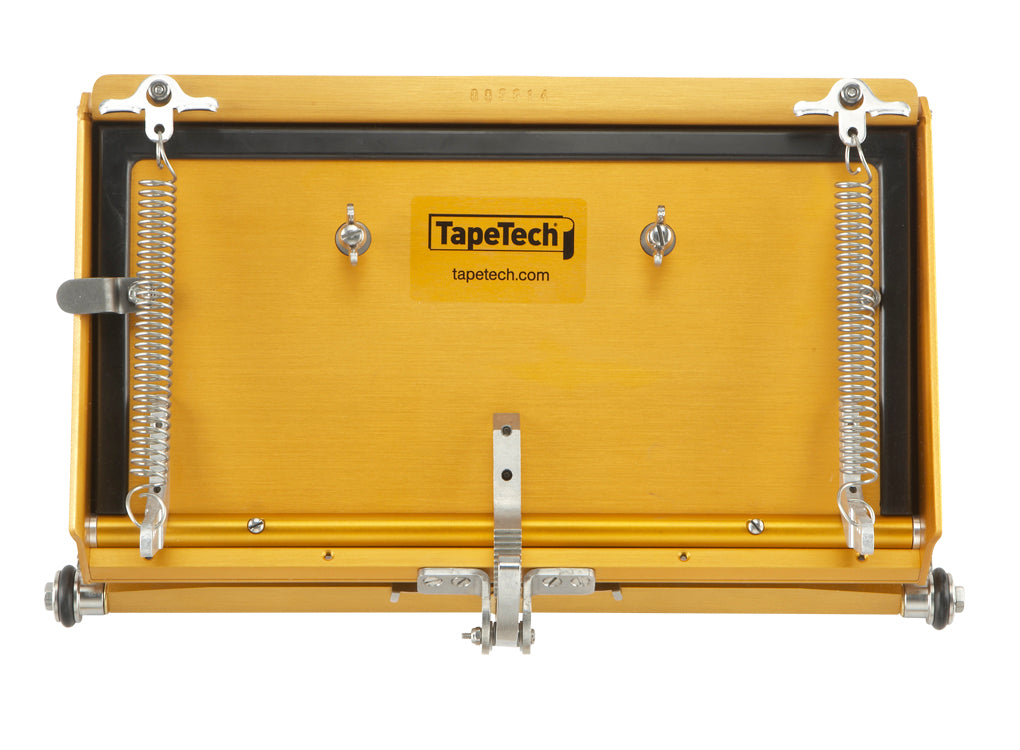 Back of 12-inch TapeTech Power Assist MAXXBOX Flat Box with gold aluminum body, reverse springs, rubber seal, and stainless steel tires
