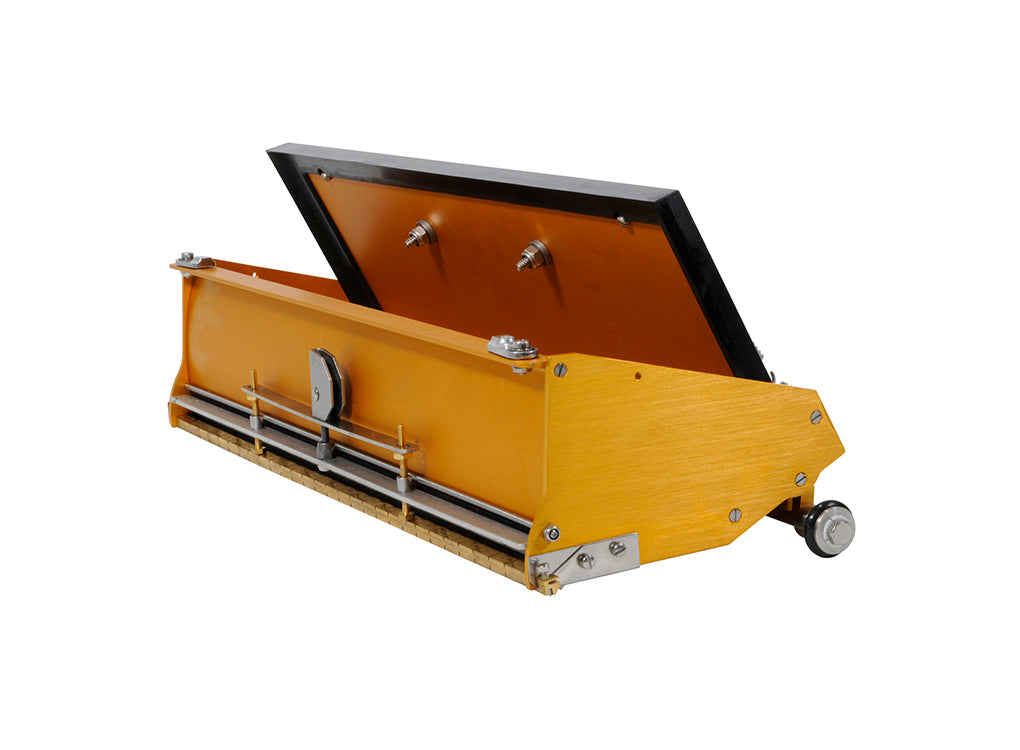 Open TapeTech EasyClean Finishing Box with gold aluminum body, brass blade holder, and crown control, quarter view