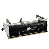 12-inch Columbia Automatic Flat Finishing Box made from billet aluminum with a black painted finish, steel components, a brass blade holder, and wheels