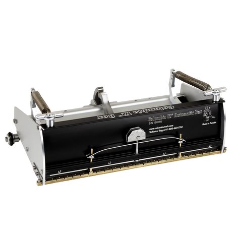 12-inch Columbia Automatic Flat Finishing Box made from billet aluminum with a black painted finish, steel components, a brass blade holder, and wheels